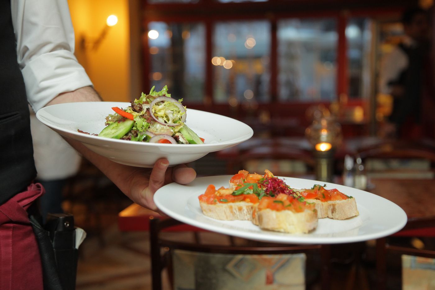 Freshly plated dishes being served in a restaurant